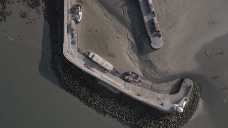 aerial top view of dry port in balbriggan sea town in ireland - drone shot