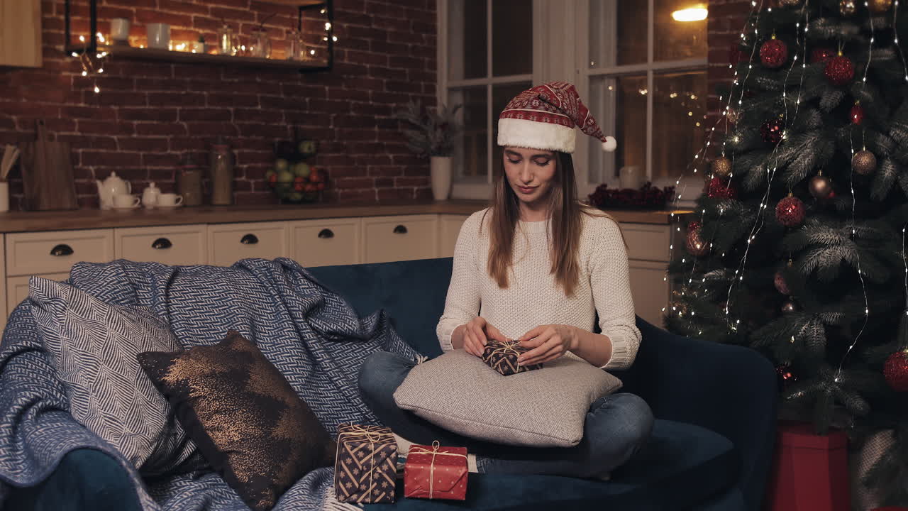Woman with Christmas Presents at Home
