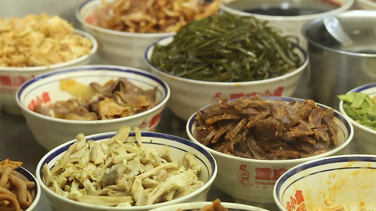 A variety of Asian ingredients neatly arranged in bowls, showcasing diverse textures and colors.