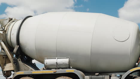 A-Large-Industrial-Concrete-Mixer-A-Tank-With-An-Ieton-Rotates-Against-The-Sky-Concrete-Delivery-And