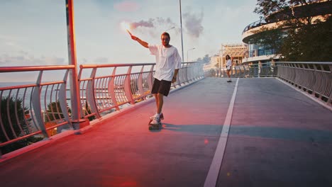 millennial couple riding skateboard with red burning signal fire