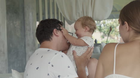 young father playing with baby