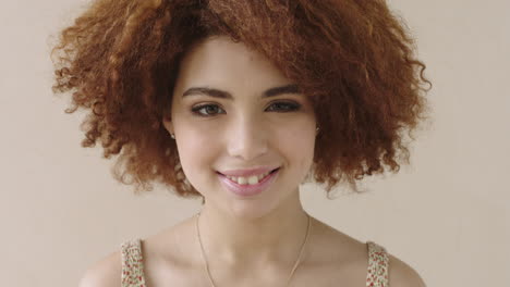 portrait-of-beautiful-woman-with-afro-smiling-happy-mixed-race