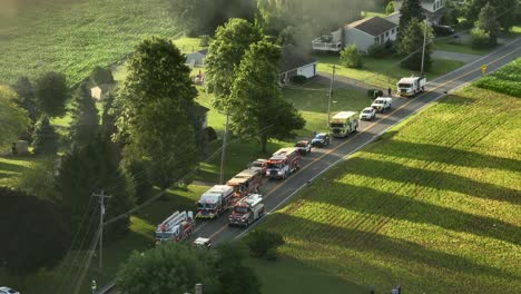 Firefighters-and-fire-trucks-at-the-propane-leak-explosion-site-in-rural-USA,-Aerial-View