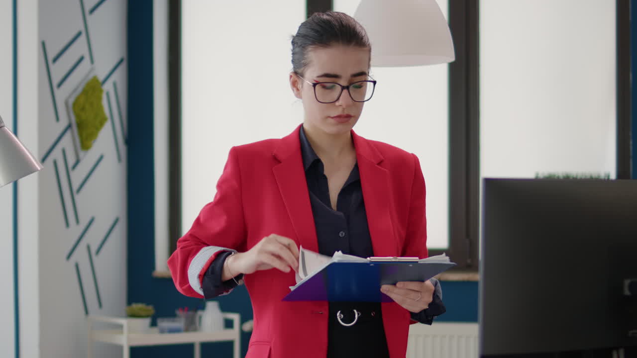 Executive assistant analyzing sales statistics on charts