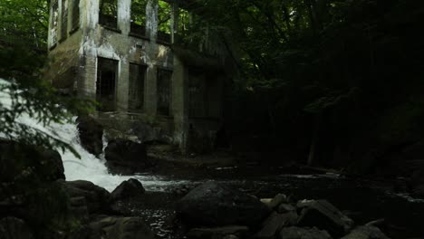 old abandoned mill in the middle of a gorgeous river ravine surrounded by woods in the middle of the gatineau hills, quebec