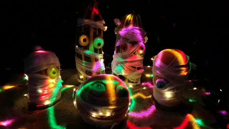 halloween mummies dancing in the rays of the disco ball