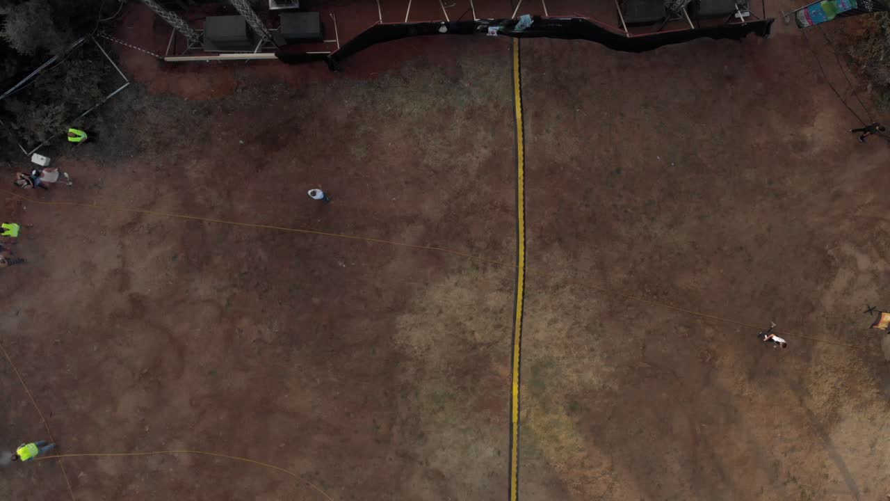 AERIAL shot of big music live stage and area around it people preparing the live people working