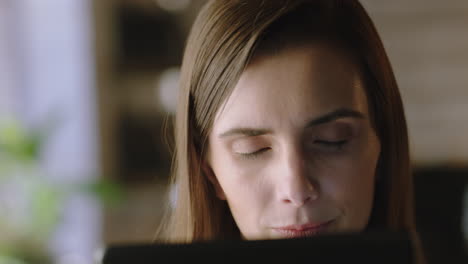 close-up-portrait-beautiful-woman-using-digital-tablet-computer-in-cafe-enjoying-browsing-online-watching-entertainment-on-mobile-internet-connection