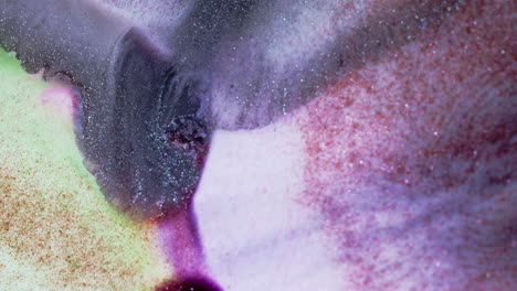 abstract close-up of colorful textures blending vibrant pinks, purples, and glittery hues