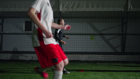 young female soccer players training indoors