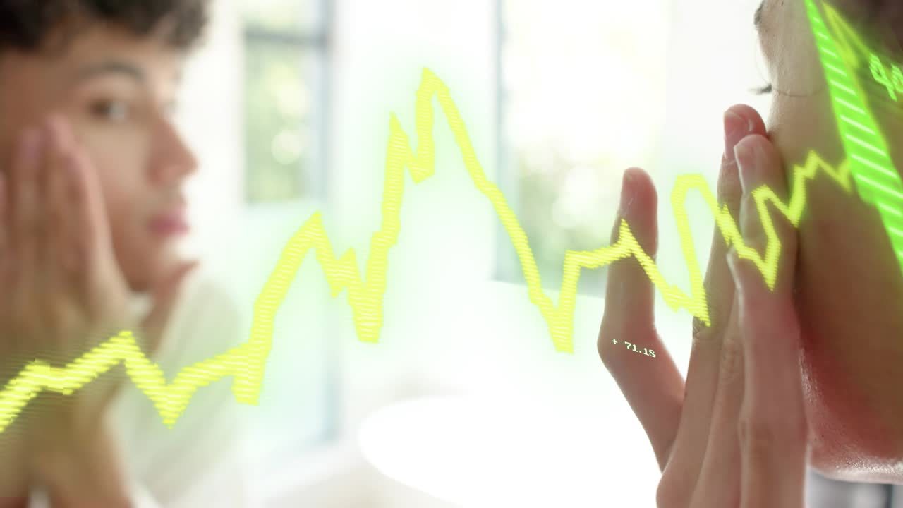 Adult man glancing into bathroom mirror, touching cheeks while yellow waveform tracking skin health