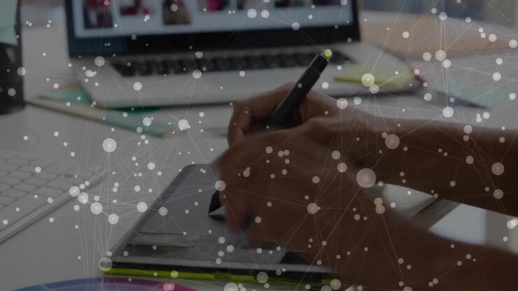 Rotating designer hands selecting hues on color wheel at desk, matching screen, drawing on tablet