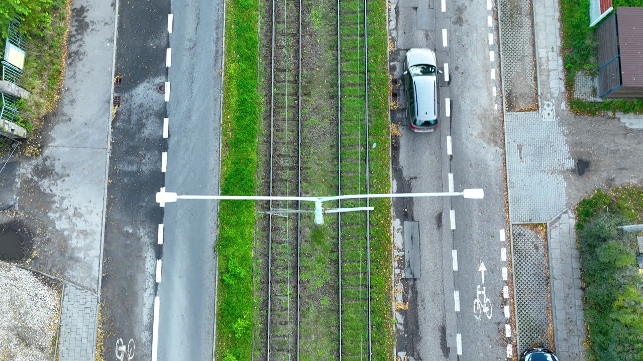 Drone view of road, tram lines and vehicles in Gdańsk