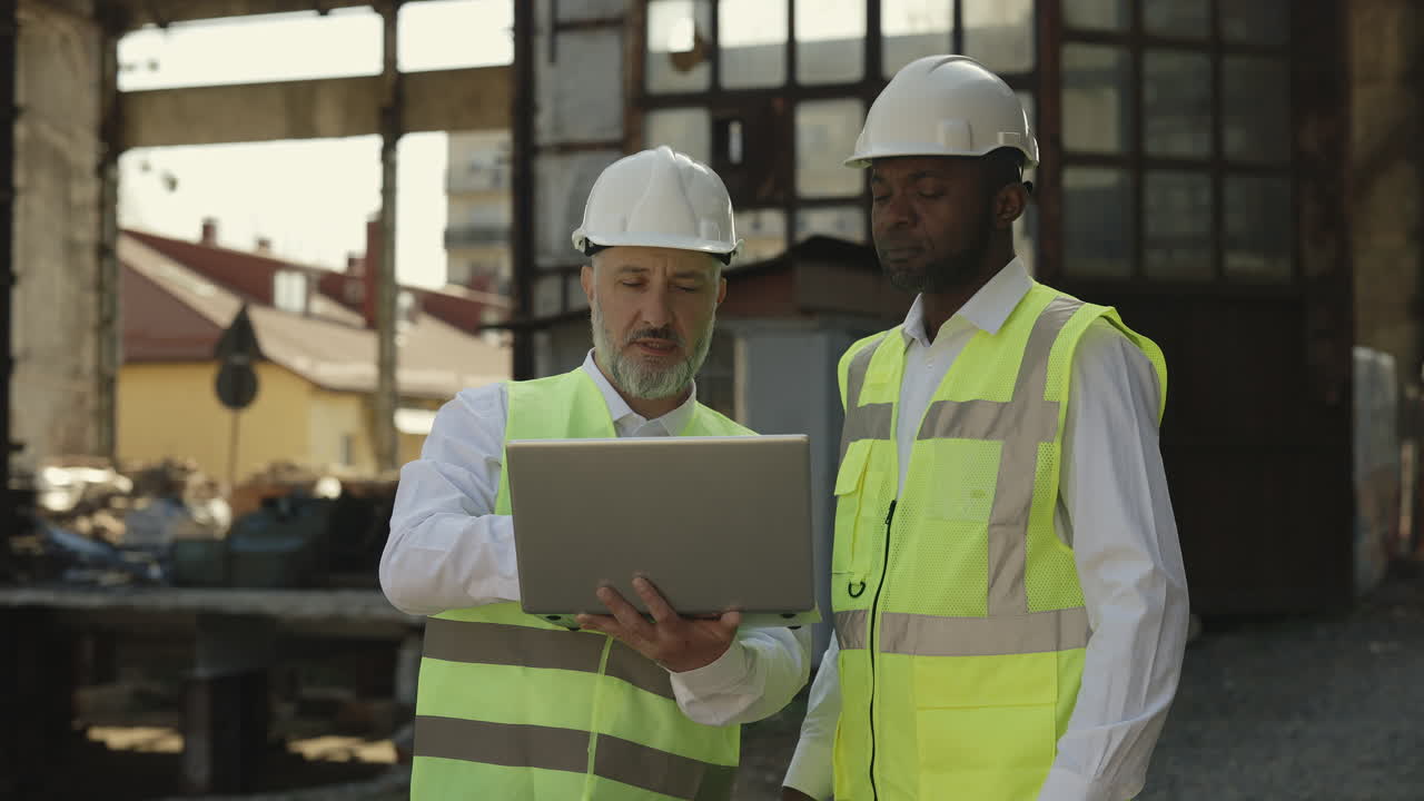 Construction Engineers Reviewing Project on Site