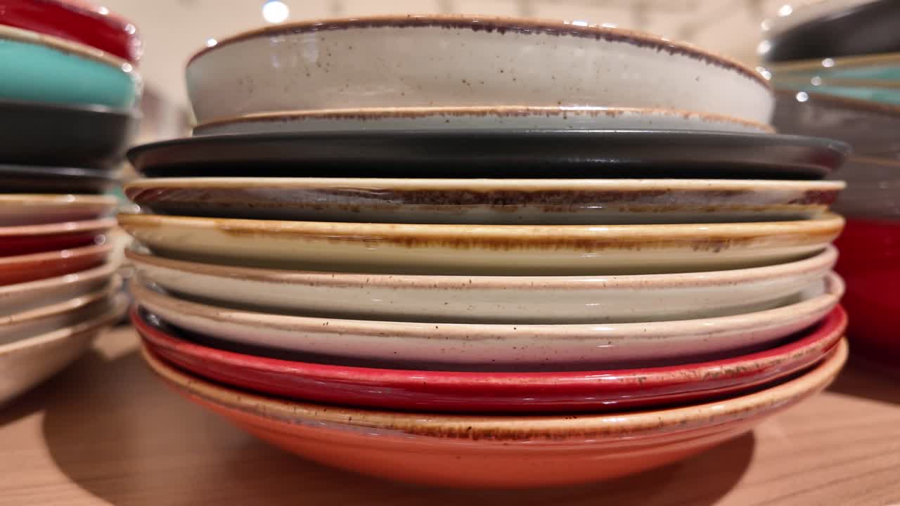 Stack of Colorful Ceramic Plates and Bowls