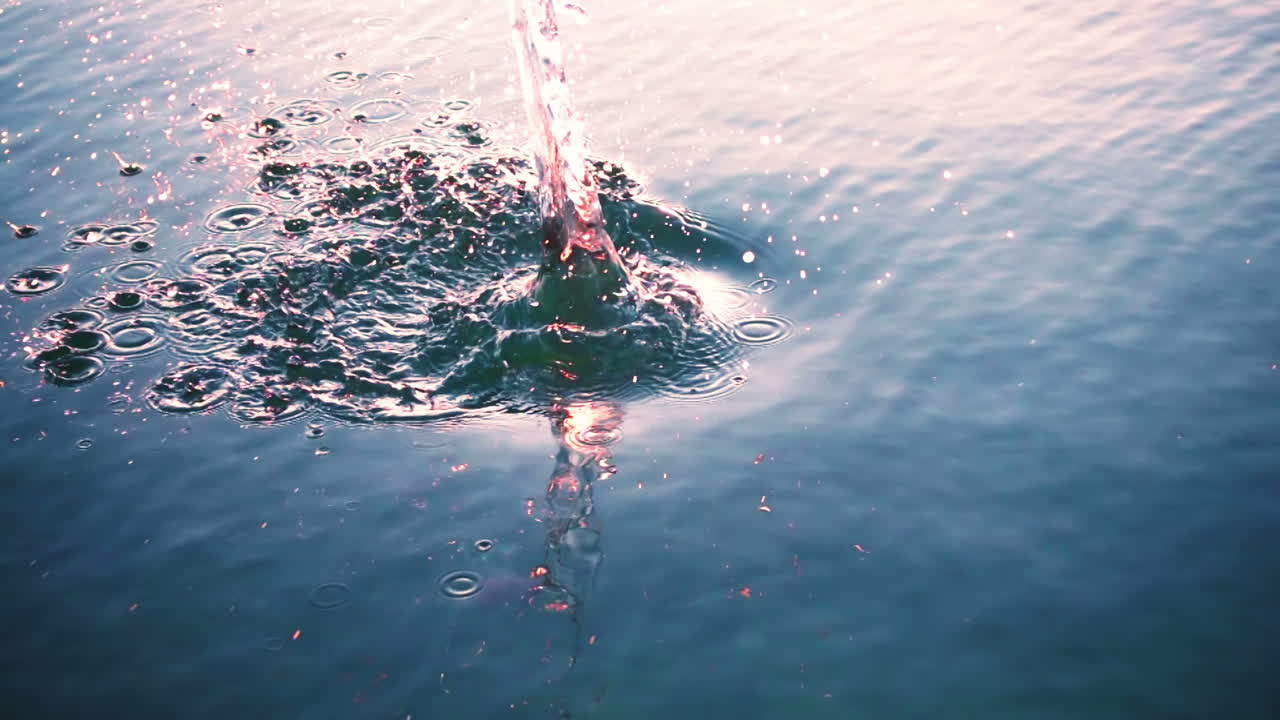 The stone falls in water. Slow Motion