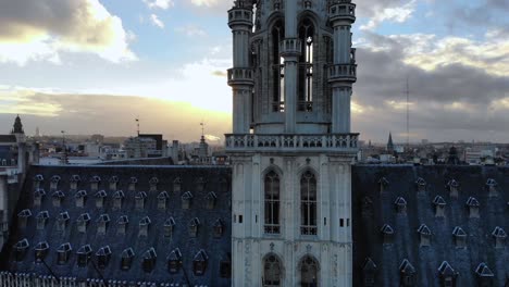 Aerial-downward-flying-of-Brussels-Town-Hall-Grand-Place-on-sunny-and-cloudy-day,-Brussels,-Belgium