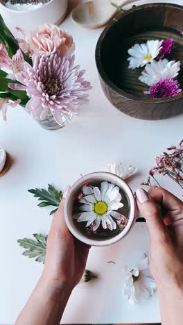 floral arrangement with a cup of tea