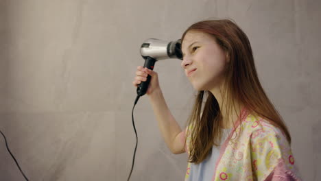 girl drying her hair