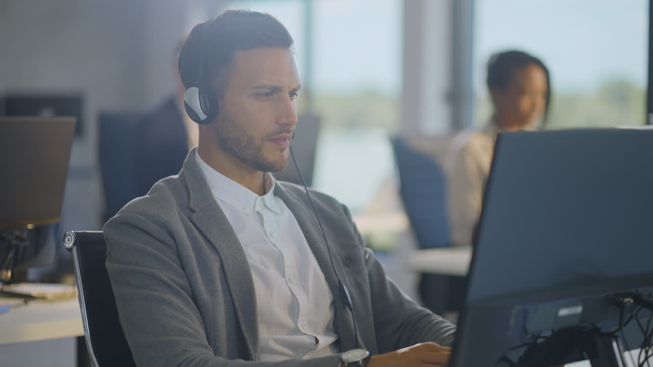Customer Service Representative Working on Computer
