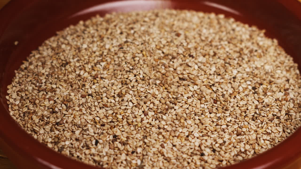 White dried sesame seeds close-up macro. Super food. Sprinkles for food.Healthy concept. High quality 4k footage