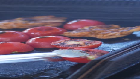 grilled chicken and tomatoes on a bbq