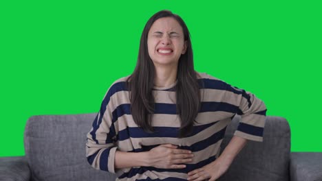 sick indian girl suffering from stomach pain green screen