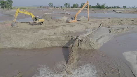 sand pumping from end of dredge.