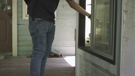 man picking up fresh eggs from the fridge of a farm