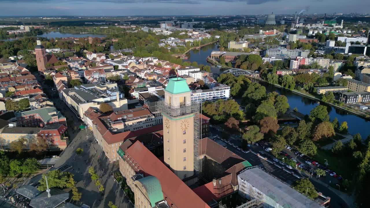 Aerial view showing Rathaus Spandau building, subway station, and public transportation in Berlin. Wonderful aerial view flight panorama orbit drone