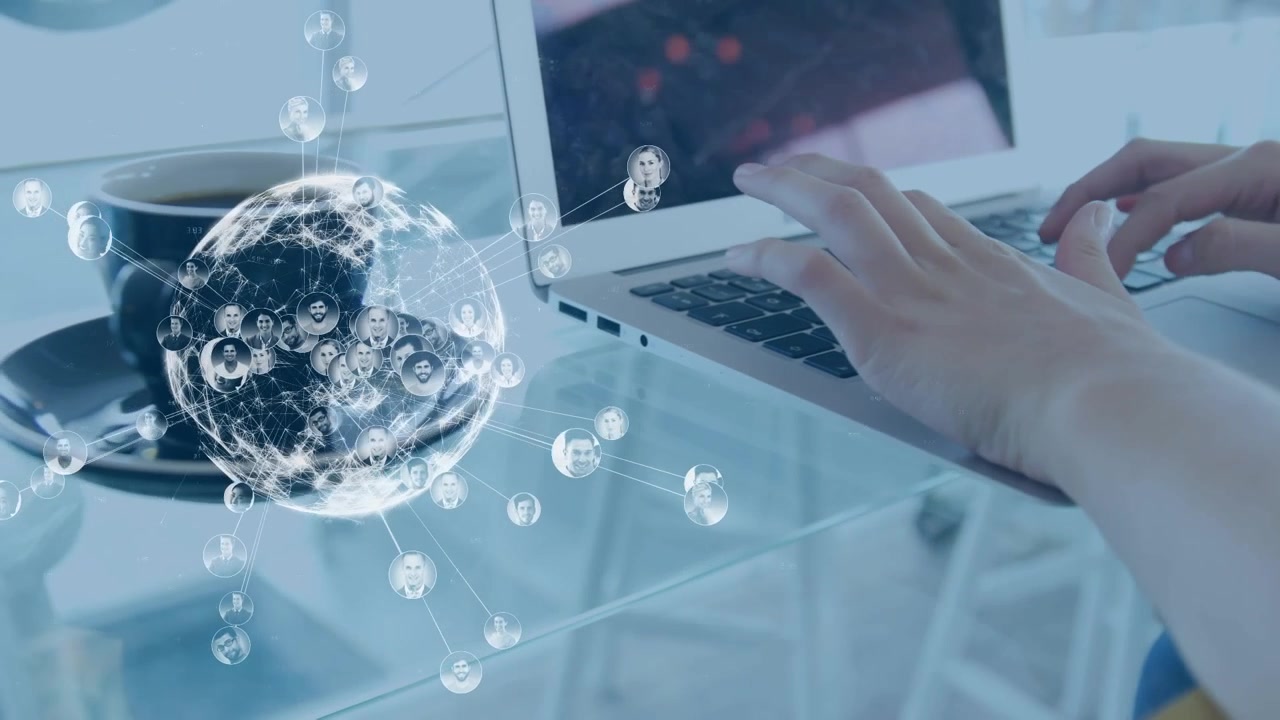 Animation of icons and globe over caucasian businesswoman using laptop