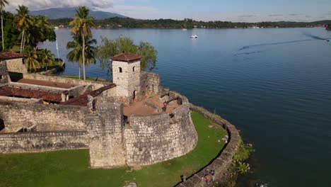 rio dulce, hispanic fortress in guatemala, cinematic drone shot