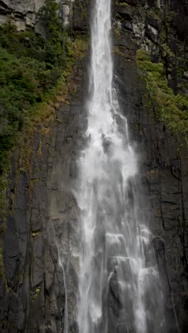 water cascading down nachi waterfall, a stunning natural wonder located in nachikatsuura, wakayama prefecture, japan. vertical video