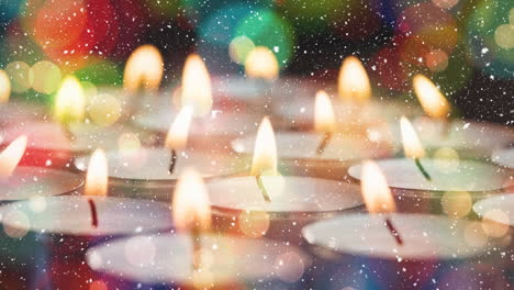 velas combinadas con la nieve que cae