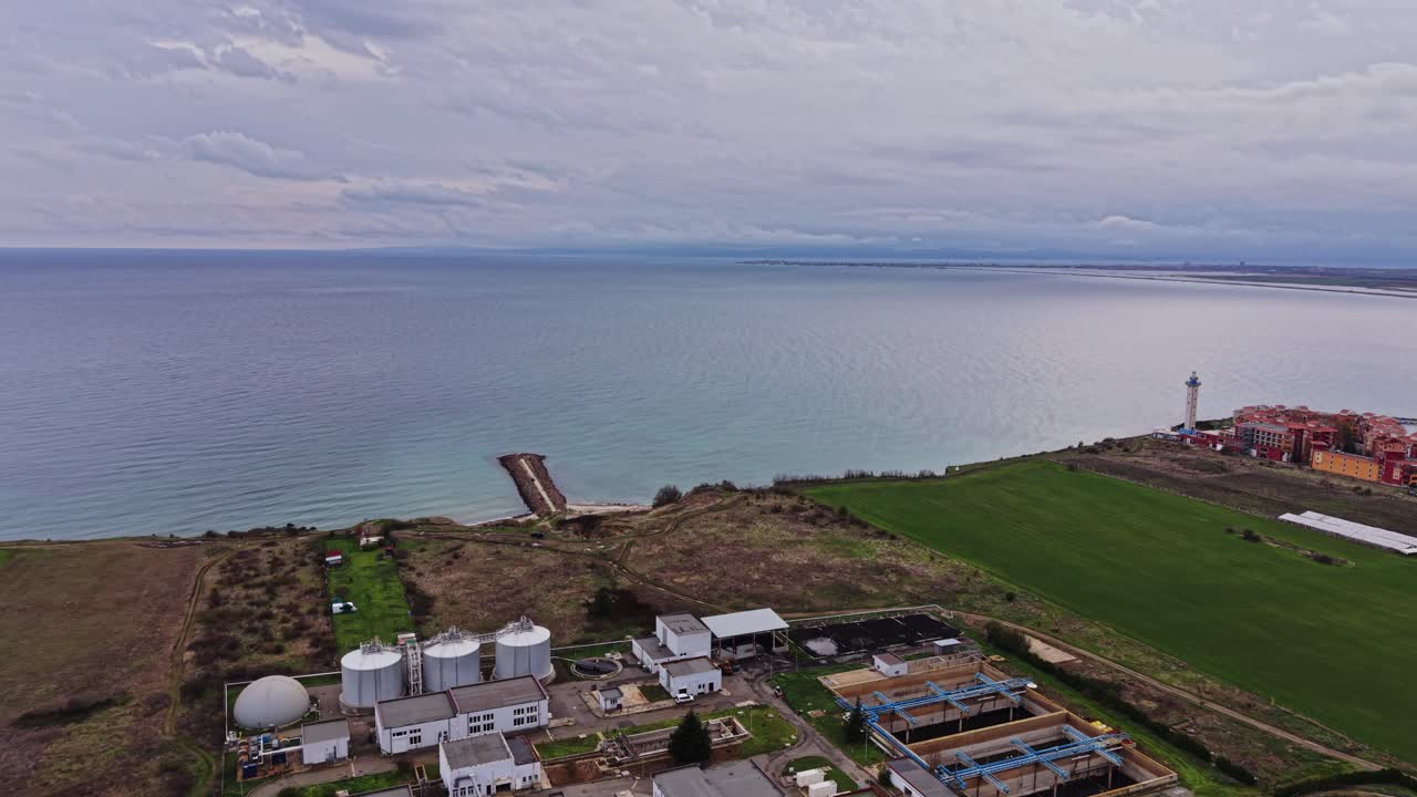 Coastal view of a wastewater treatment facility near the ocean