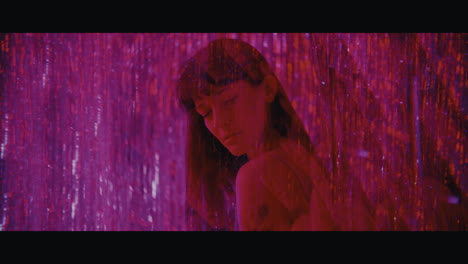 woman in a purple light display