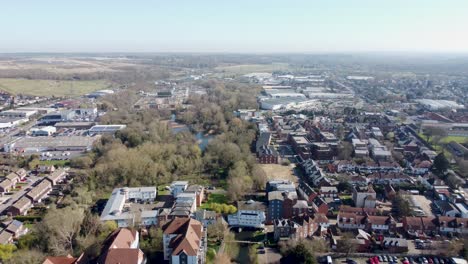 drone flies backwards over the river great stour in canterbury, england