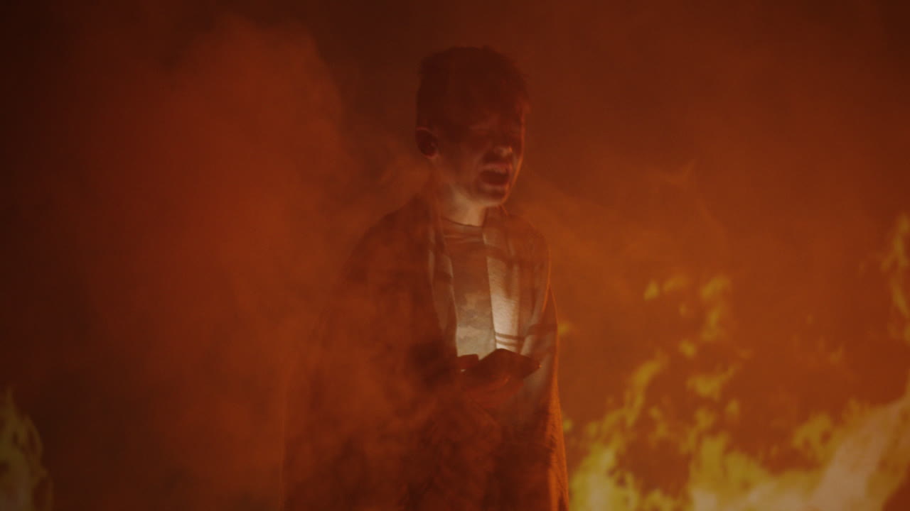 A Person Engulfed in Flames and Smoke