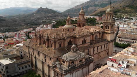 Spain-Jaen-Cathedral,-Catedral-de-Jaen,-flying-shoots-of-this-old-church-with-a-drone-at-4k-24fps-using-a-ND-filter-also-it-can-be-seen-the-old-town-of-Jaen