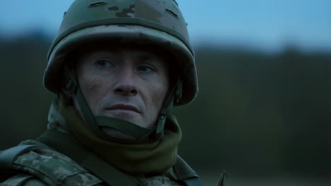 close-up portrait of a soldier in uniform and helmet