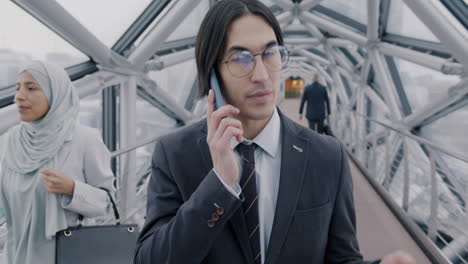 business people walking on a modern bridge