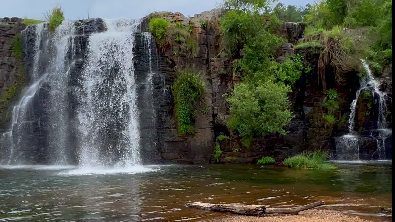 Forrest Lisbon Falls stunning peaceful waterfalls Sabie Nelsprit Johannesburg Mbombela South Africa most scenic cinematic spring greenery lush peaceful calm water closeup slow motion left pan beach