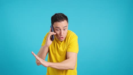 man talking on phone with expressive gestures