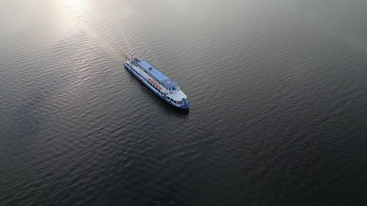 Aerial view of a boat cruising on calm water
