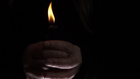 hands around a candle at vigil medium shot medium shot