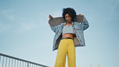 stylish woman with skateboard