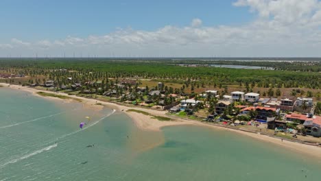 Wide-drone-shot-of-kitesurfers-riding-in-the-lagoon-of-Ilha-do-Guajiru