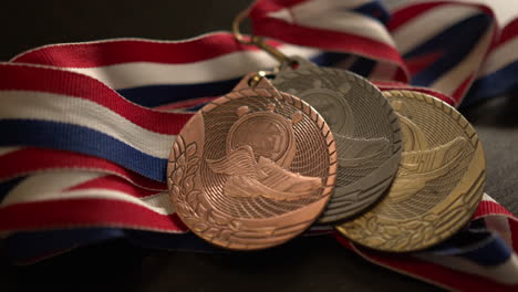 close up of track medals on a table