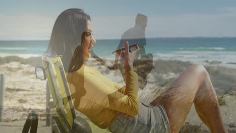 using smartphone, woman relaxing on beach chair with animation of man walking